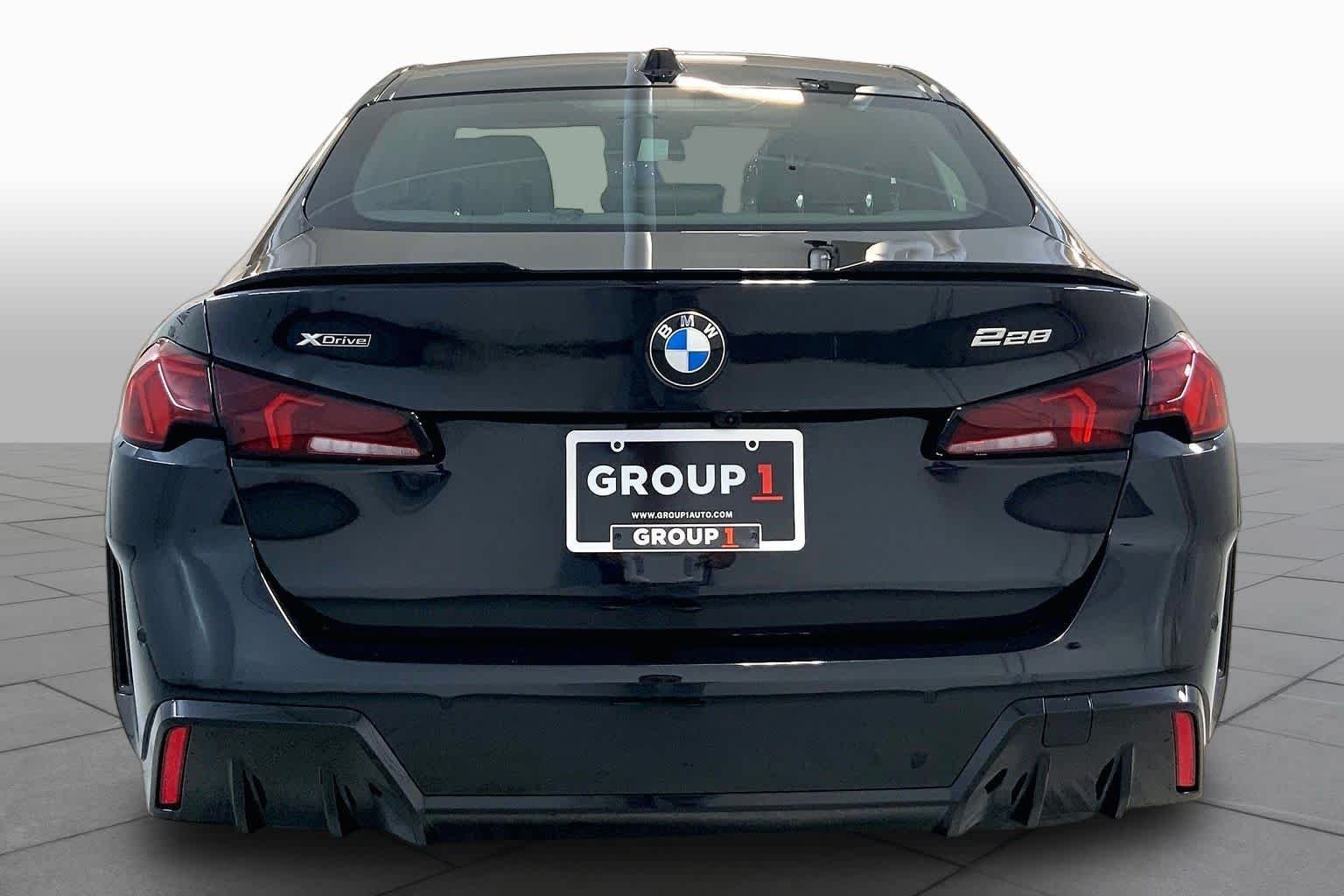 Used 2025 Black Sapphire Metallic BMW 228 xDrive image 4