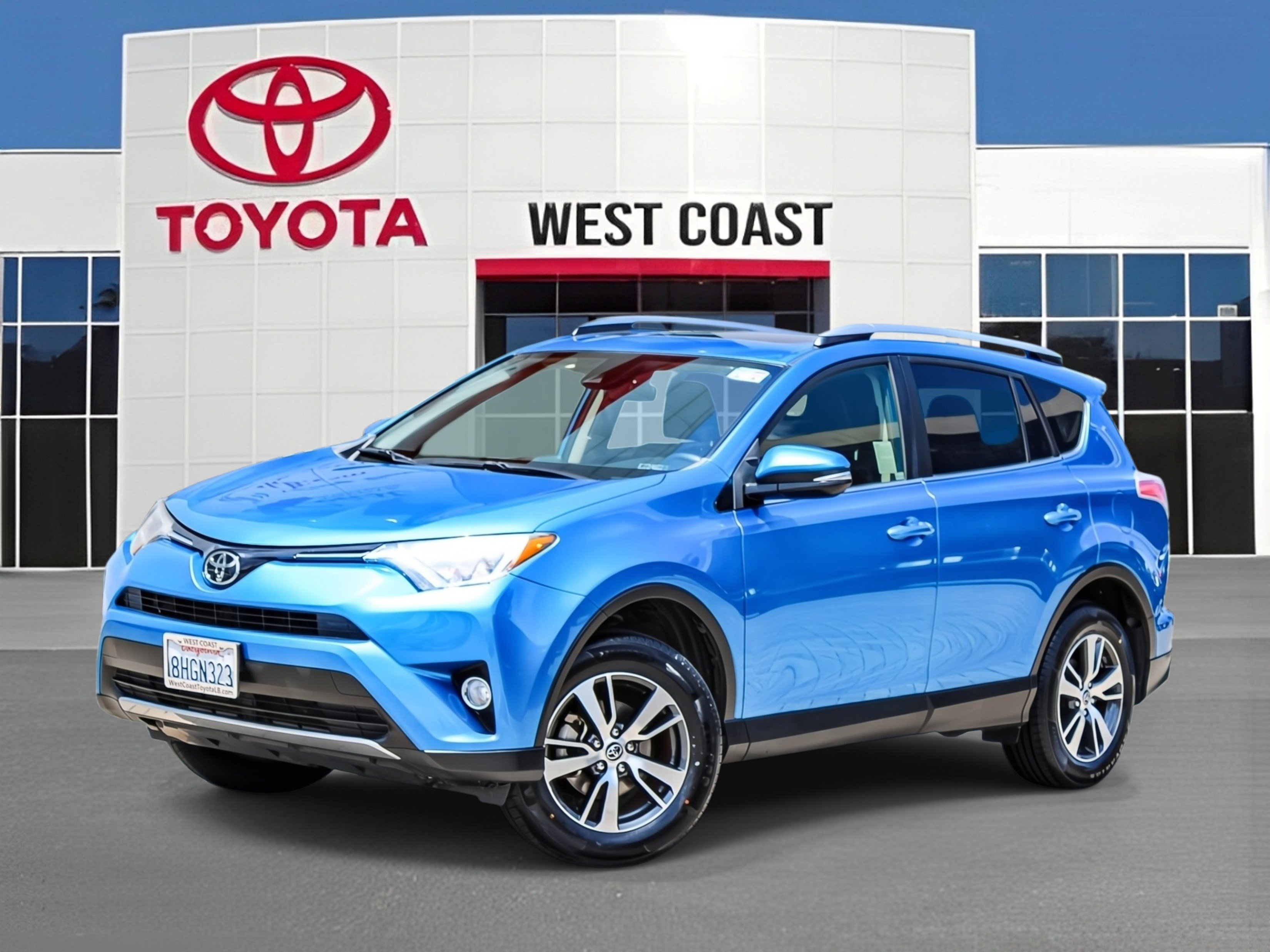 Used 2018 Electric Storm Blue Toyota XLE image 1