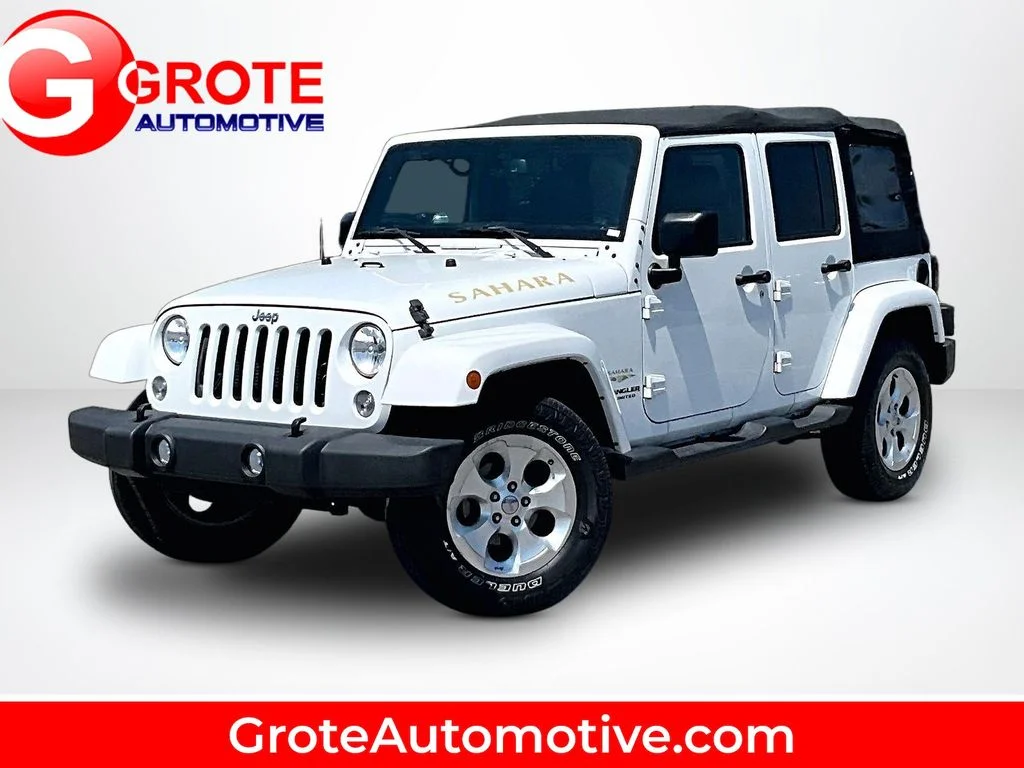 Used 2015 White Jeep Unlimited Sahara image 1