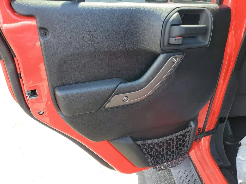 Used 2013 Red Jeep Unlimited Sport image 9