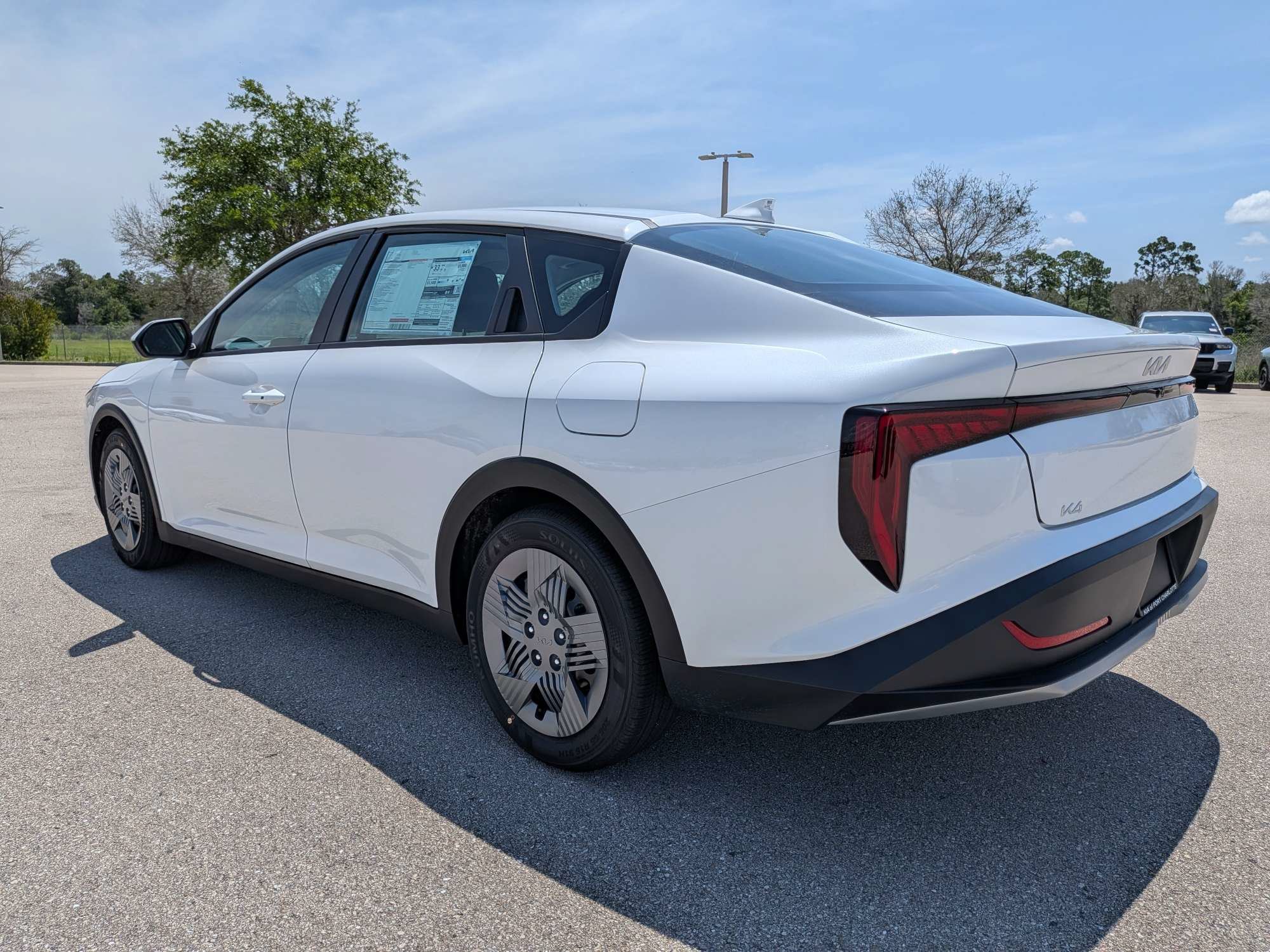 New 2026 Snow White Pearl Kia LX image 7