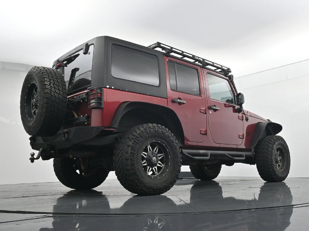 Used 2012 Red Jeep Unlimited Sport image 23