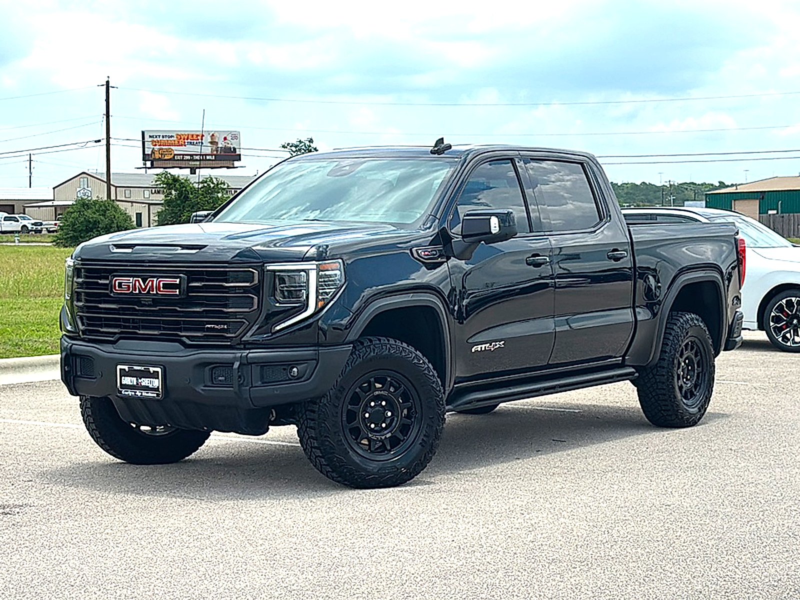 Used 2026 Onyx Black GMC Crew Cab, Short Bed, AT4X, 4WD image 2