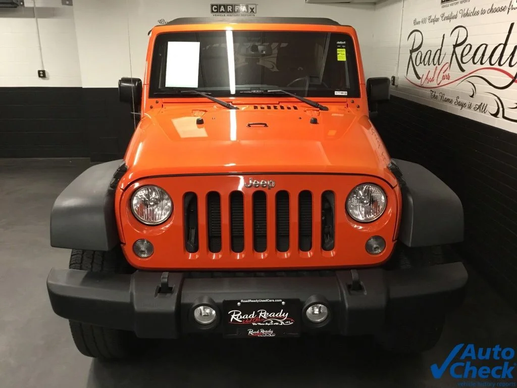 Used 2015 Orange Jeep Unlimited Sport image 4