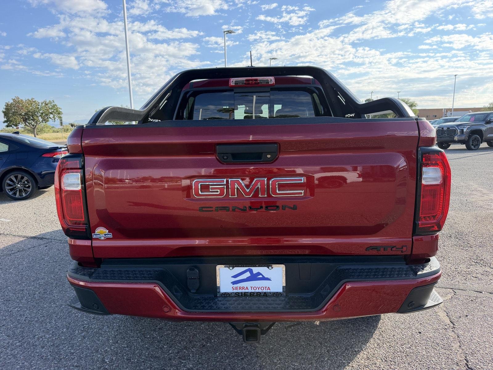 Used 2025 Volcanic Red Tintcoat GMC 4WD AT4 image 4