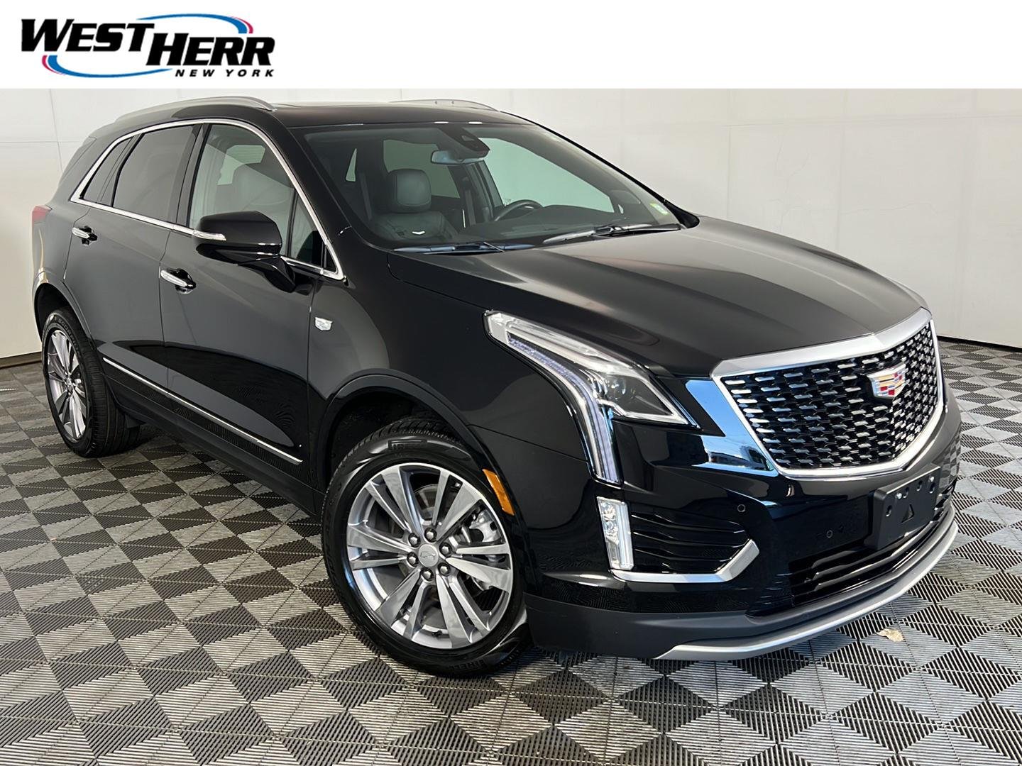 Used 2024 Stellar Black Metallic Cadillac AWD Premium Luxury image 1