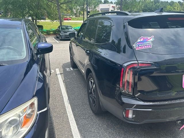 Used 2025 Black Kia EX X-Line image 12