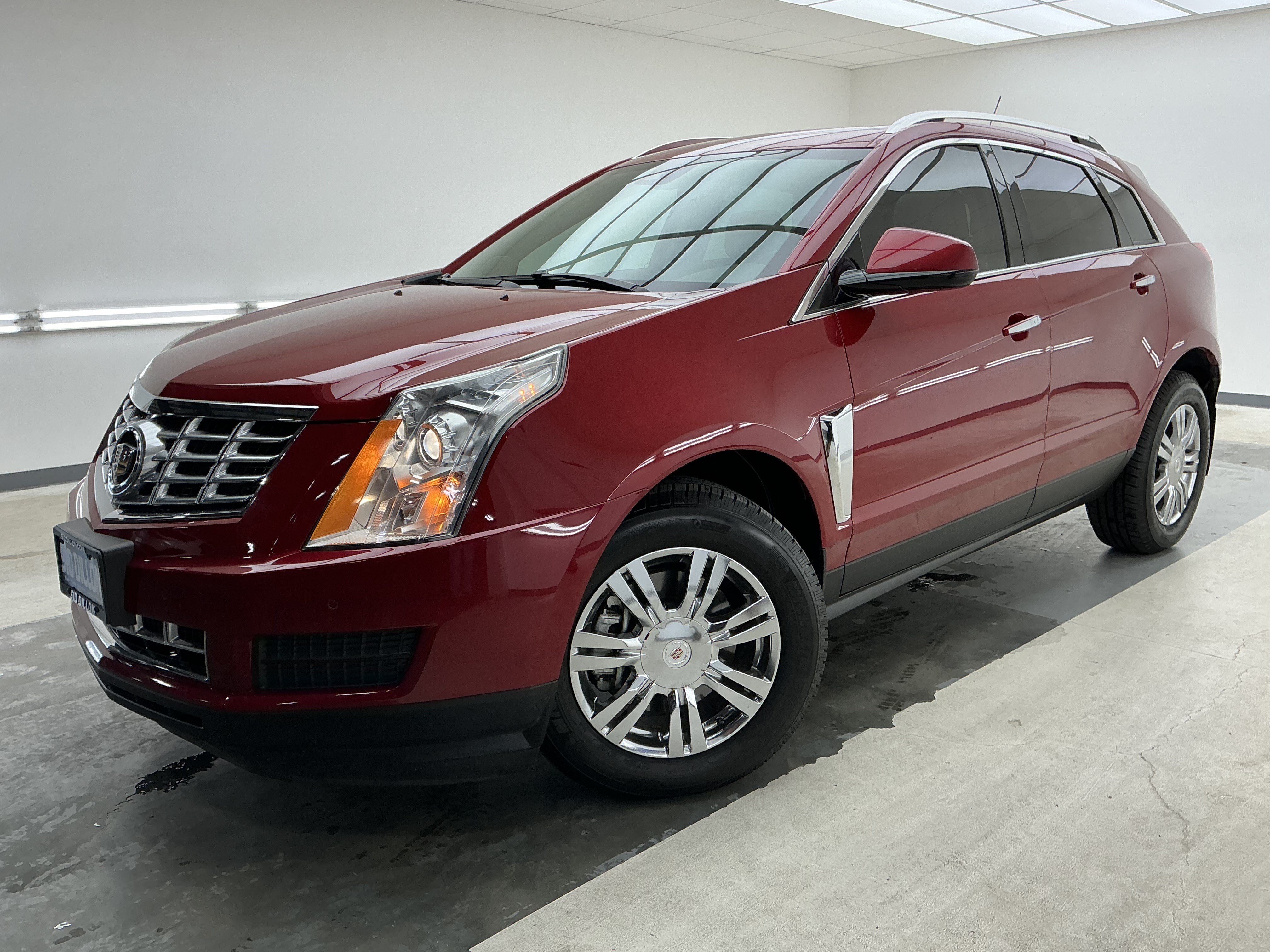 Used 2015 Crystal Red Tintcoat Cadillac Luxury Collection image 1