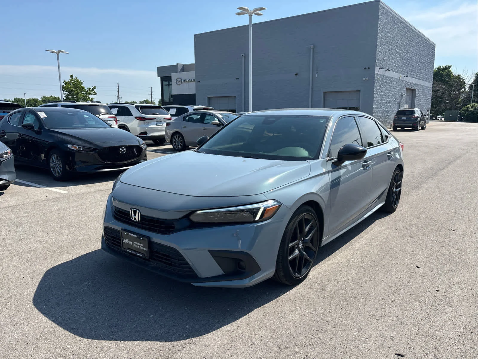 Used 2023 Honda Civic Sport with VIN 2HGFE2F5XPH552574 for sale in Kansas City