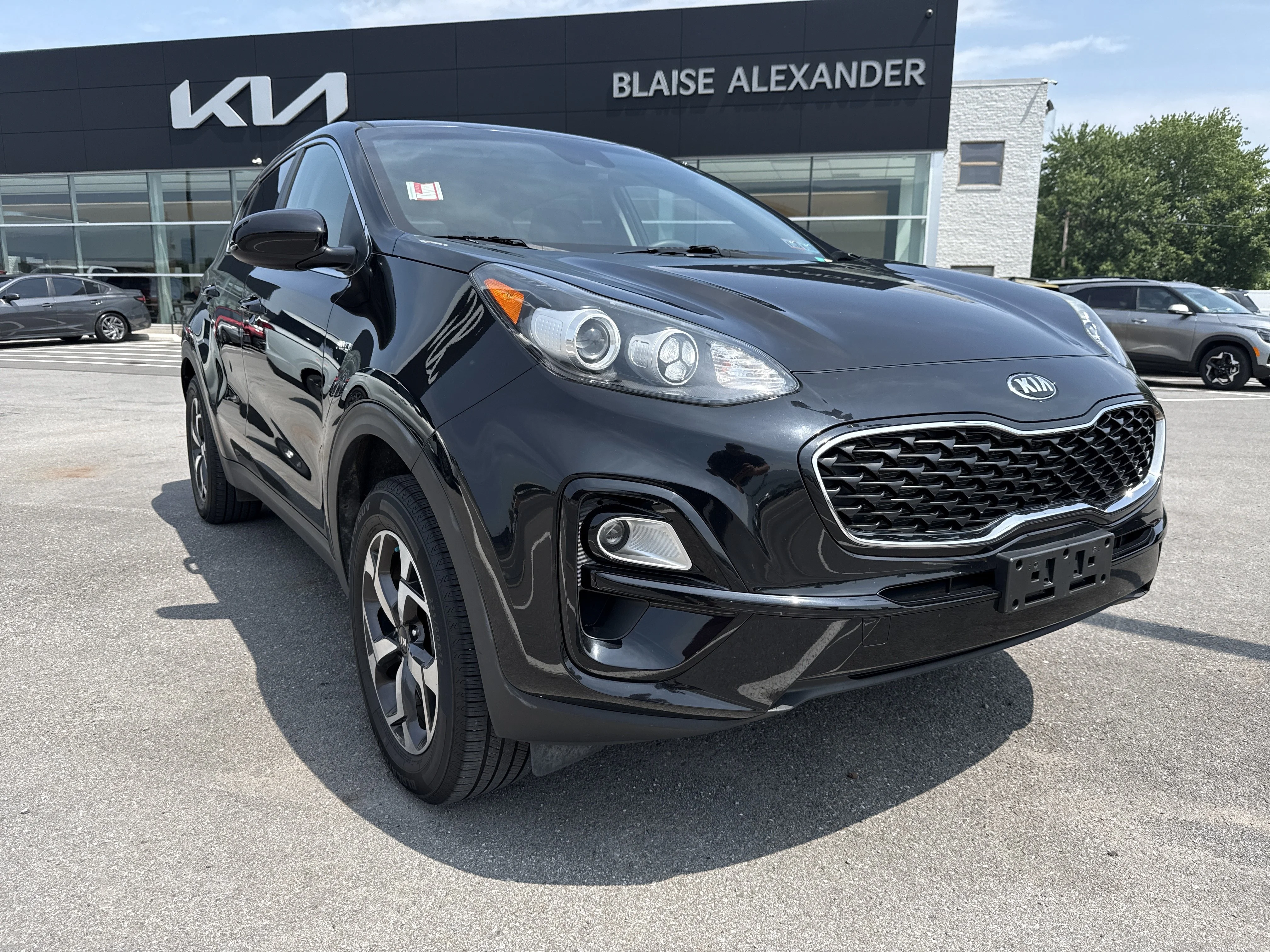 Used 2020 Black Cherry Pearl Kia LX image 1