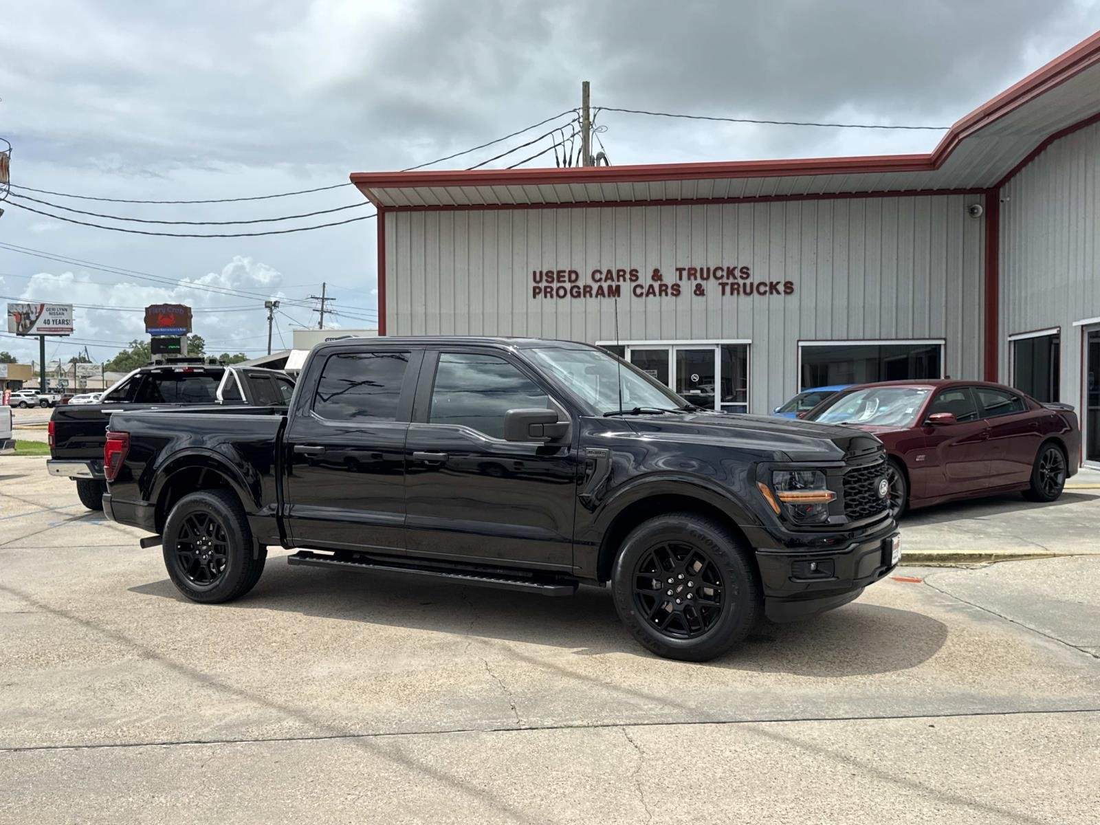 Used 2024 Agate Black Metallic Ford STX image 1