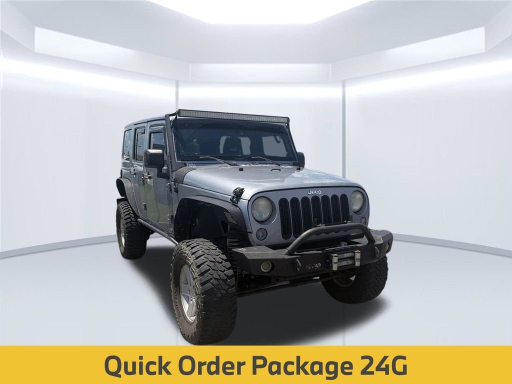 Used 2014 Billet Metallic Clearcoat Jeep Unlimited Sahara image 4