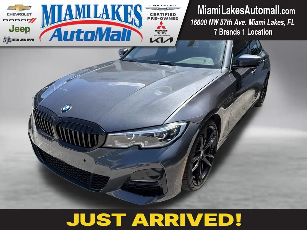 Used 2021 Mineral Gray Metallic BMW 330i image 1