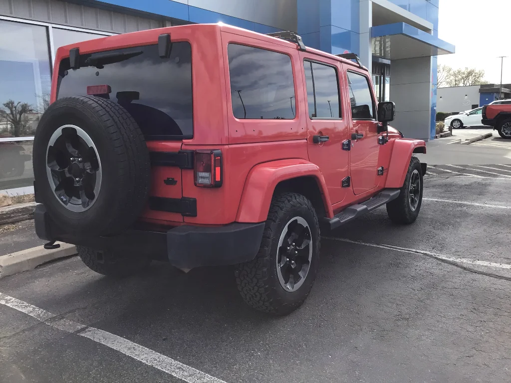 Used 2014 Red Jeep Unlimited Sahara image 5