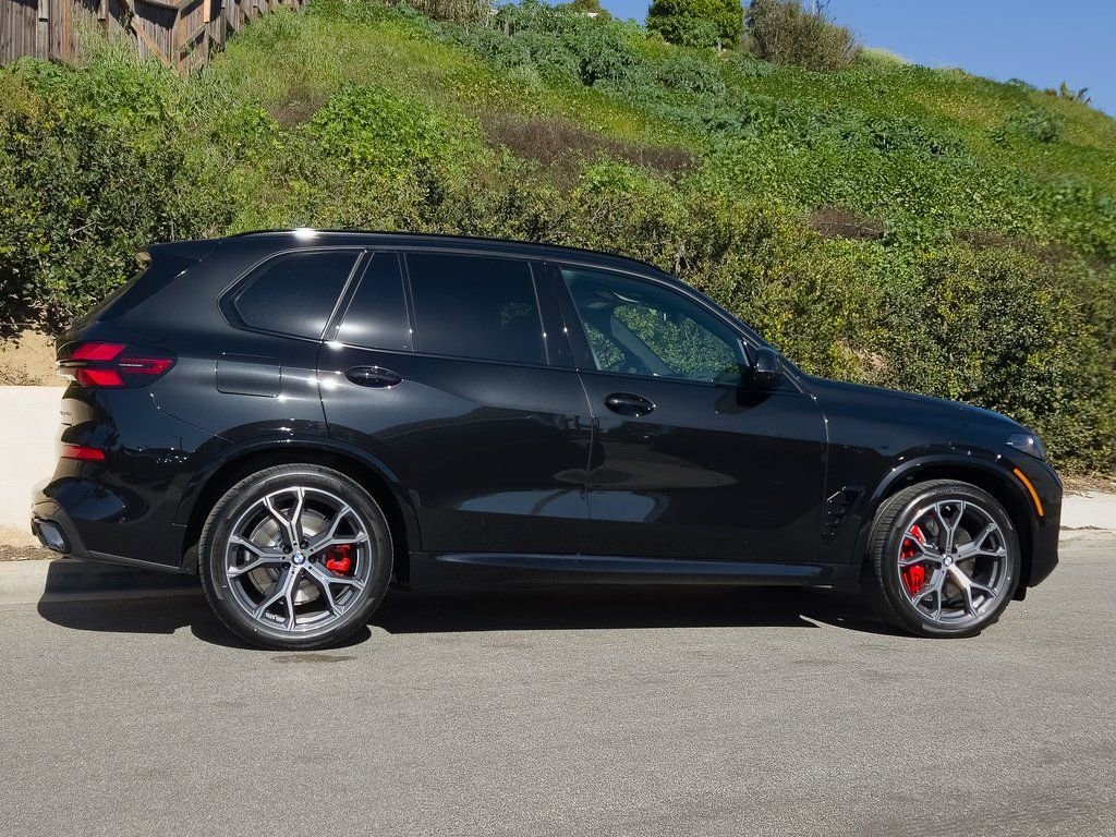 New 2026 Black Sapphire Metallic BMW xDrive50e image 4