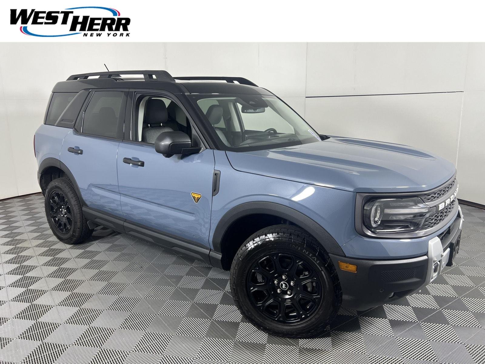 Used 2025 Azure Gray Metallic Tri-Coat Ford Badlands image 1