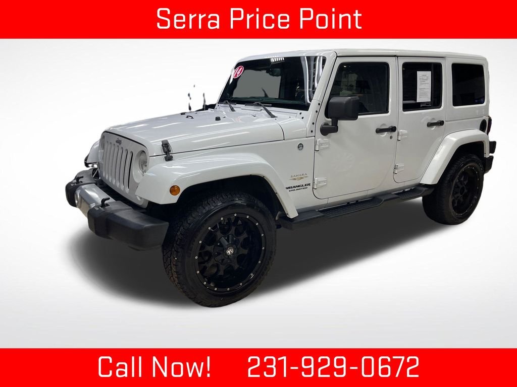 Used 2014 White Jeep Unlimited Sahara image 1