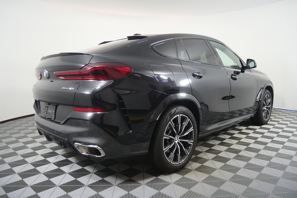 Certified Used 2025 Black Sapphire Metallic BMW xDrive40i image 2