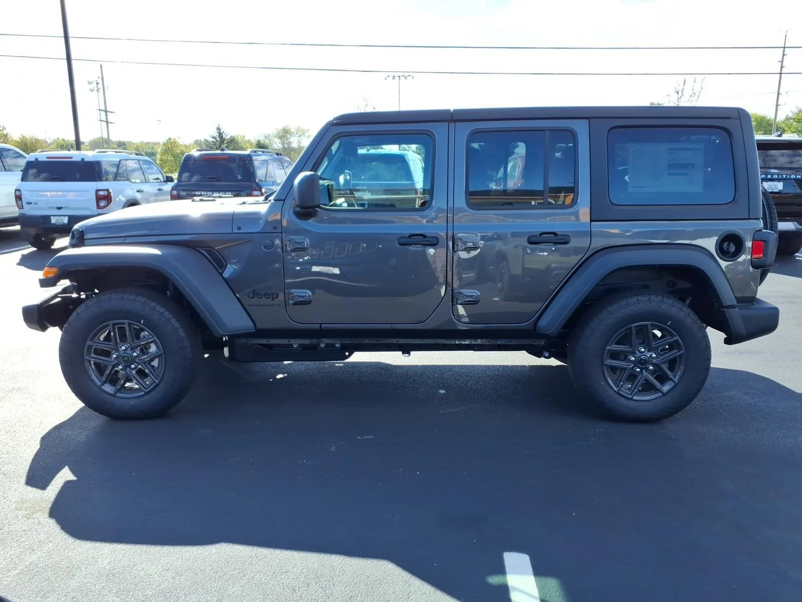 New 2027 Granite Crystal Metallic Clear-Coat Exterior Paint Jeep Sport image 3