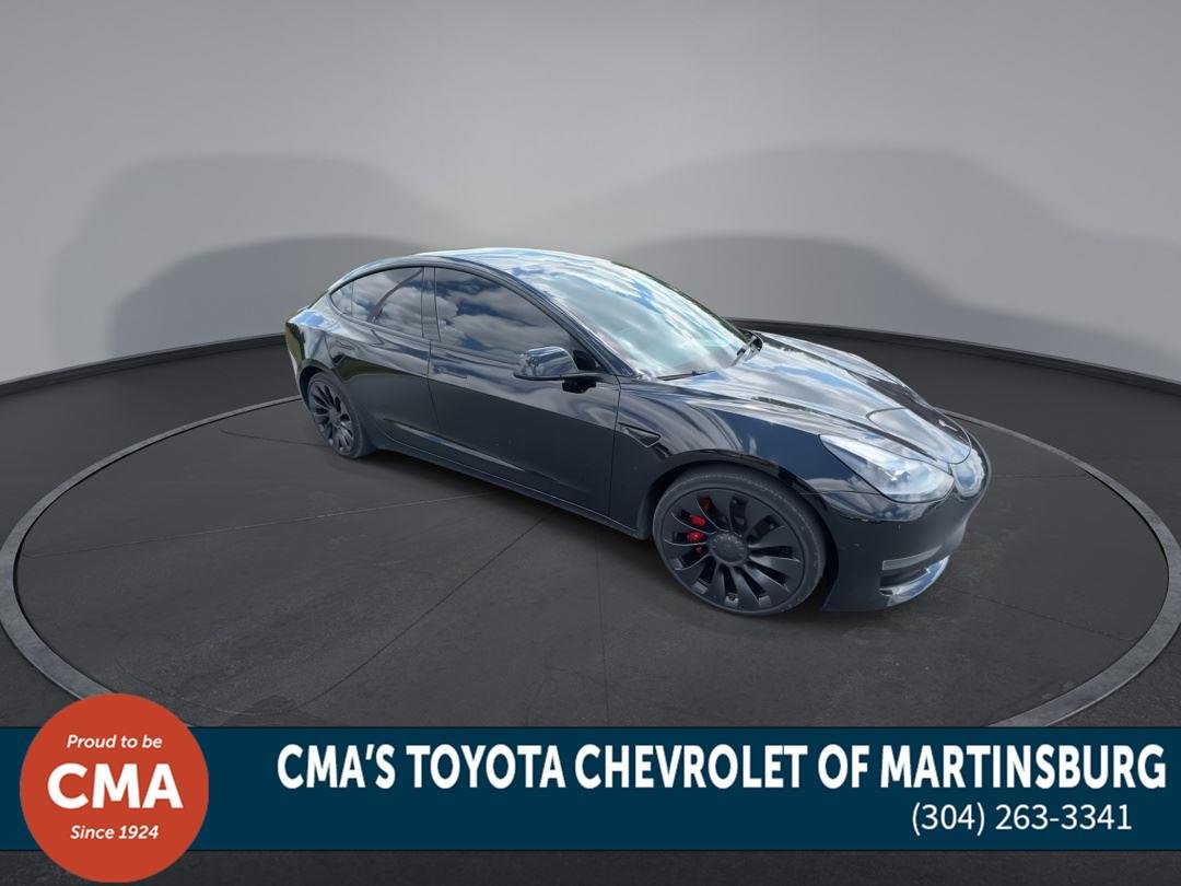 Used 2022 Solid Black Tesla Performance image 2
