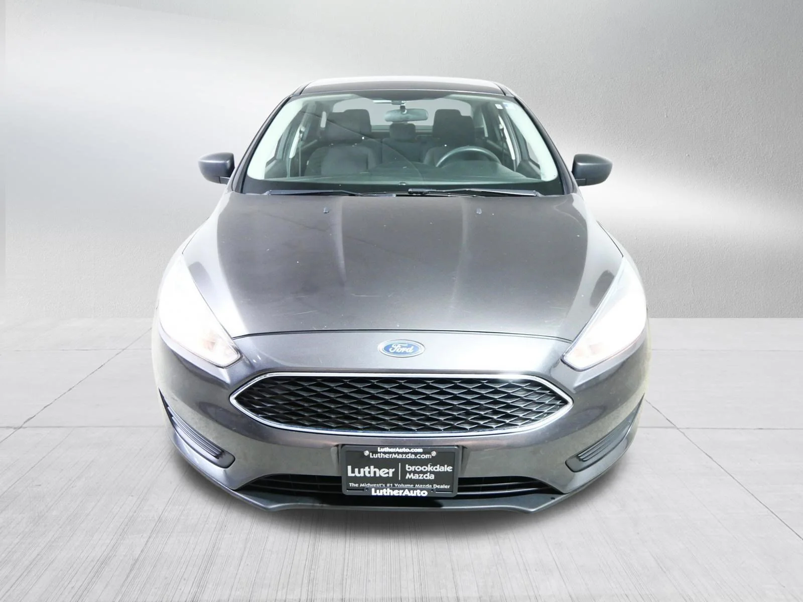 Used 2015 Ford Focus S with VIN 1FADP3E29FL277056 for sale in Minneapolis, MN