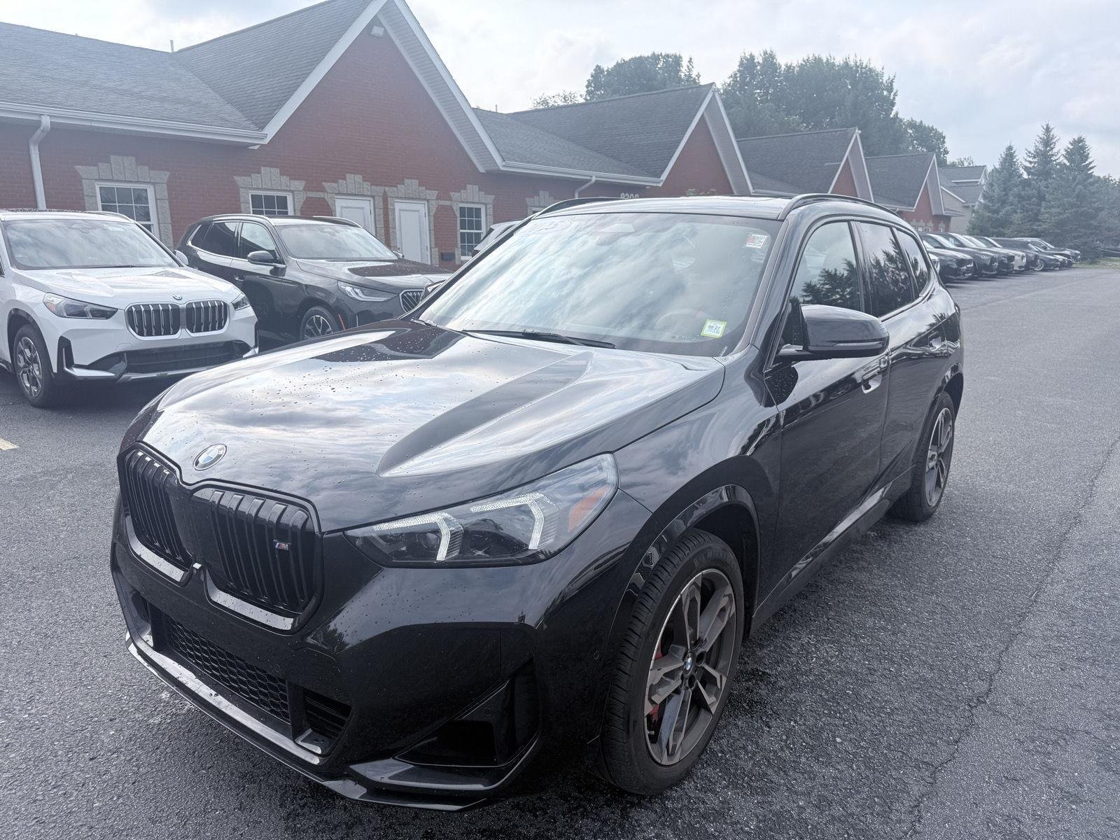 Used 2025 Black Sapphire Metallic BMW M35i image 3