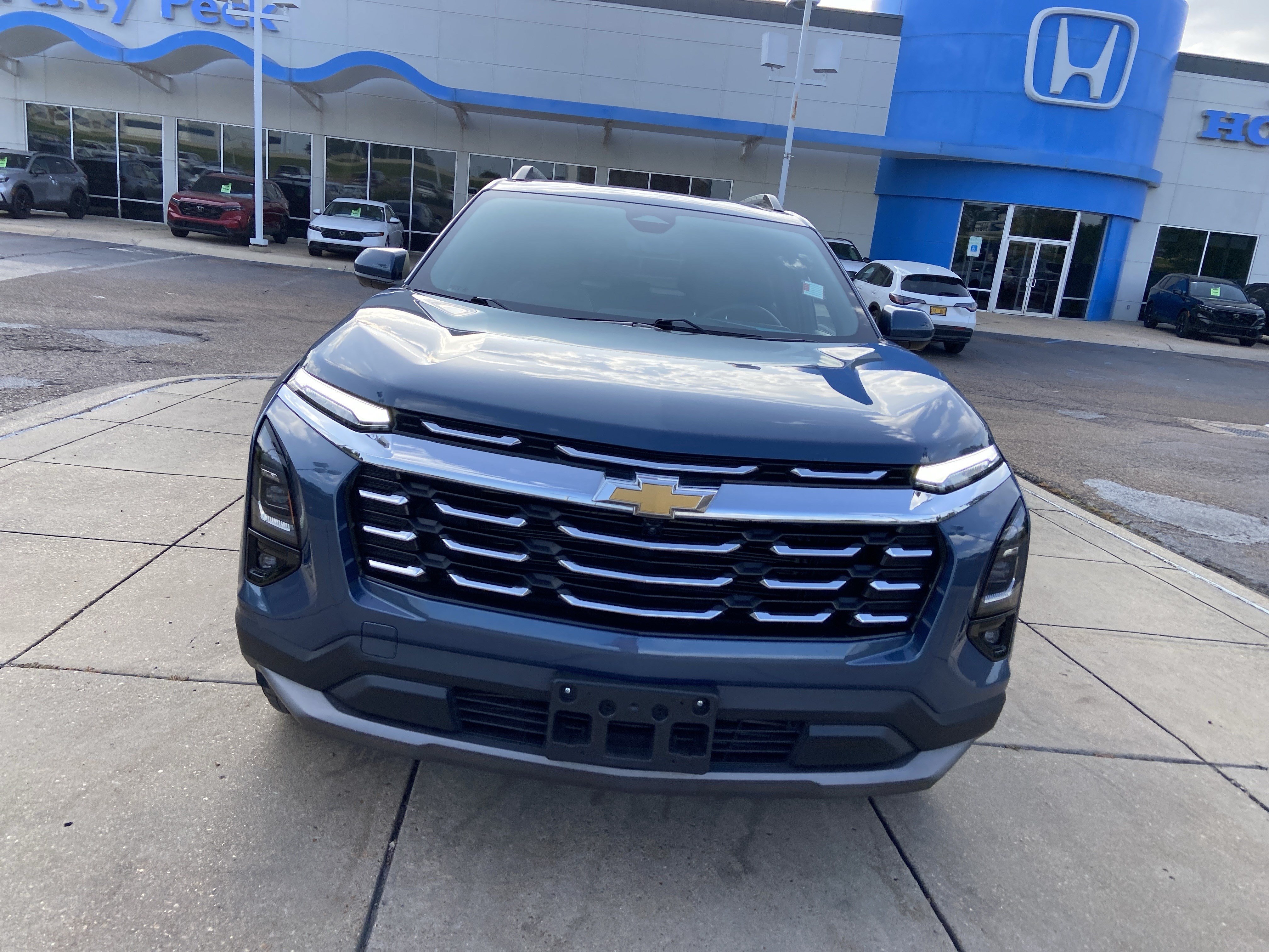 Used 2025 Lakeshore Blue Metallic Chevrolet AWD LT image 3