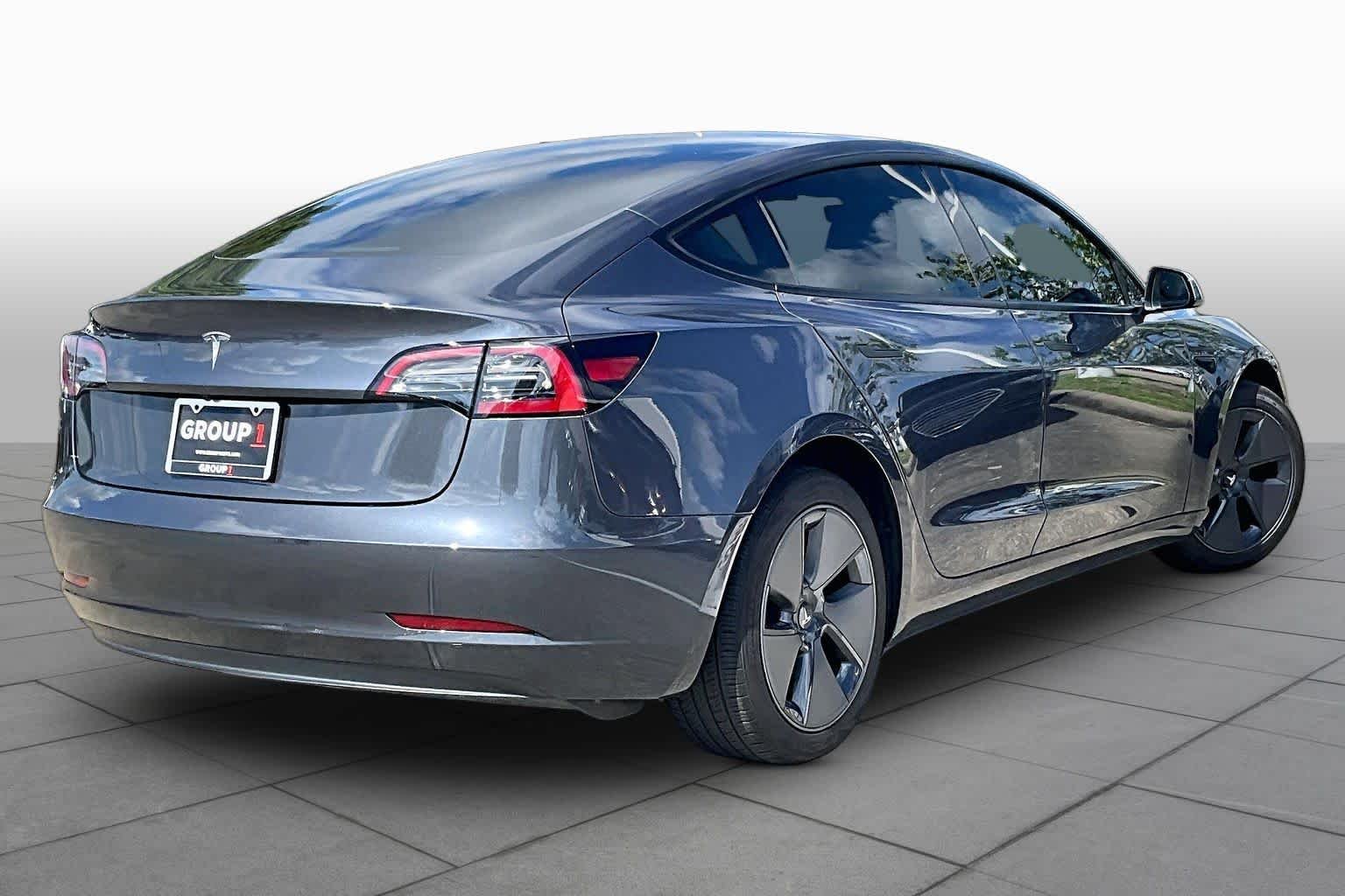 Used 2023 Solid Black Tesla  image 10