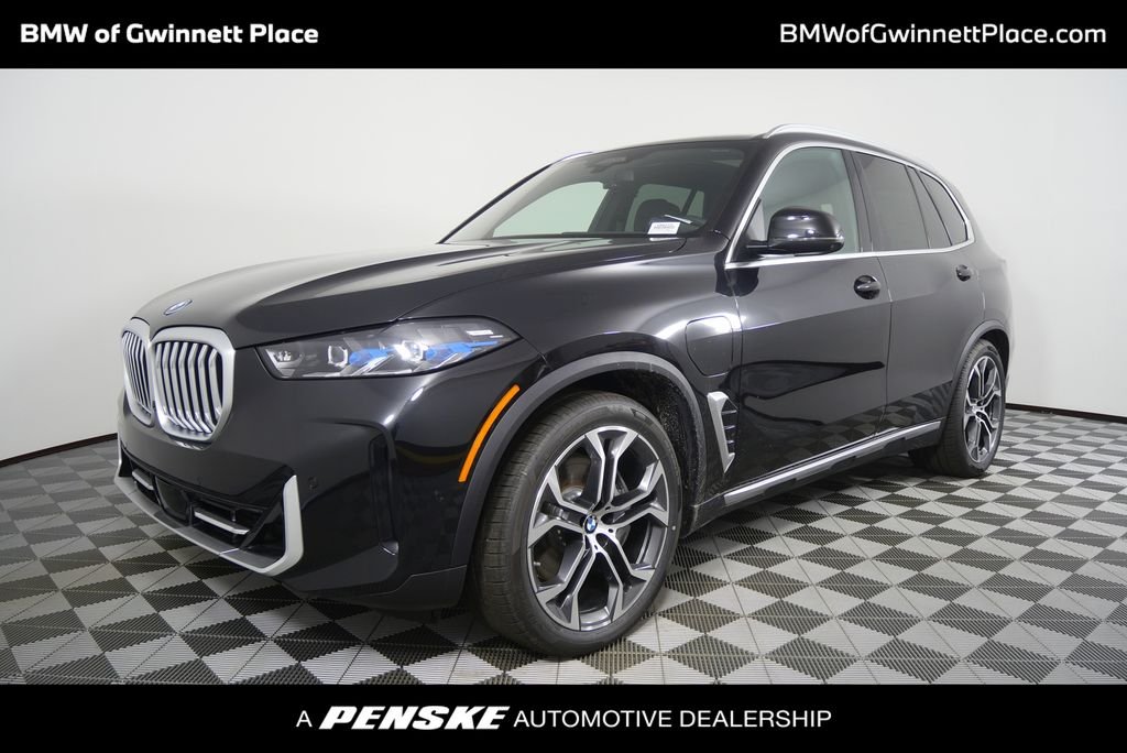 New 2026 Black Sapphire Metallic BMW xDrive50e image 1