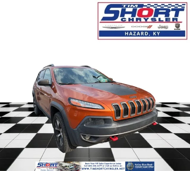 Used 2015 Orange Jeep Trailhawk image 1