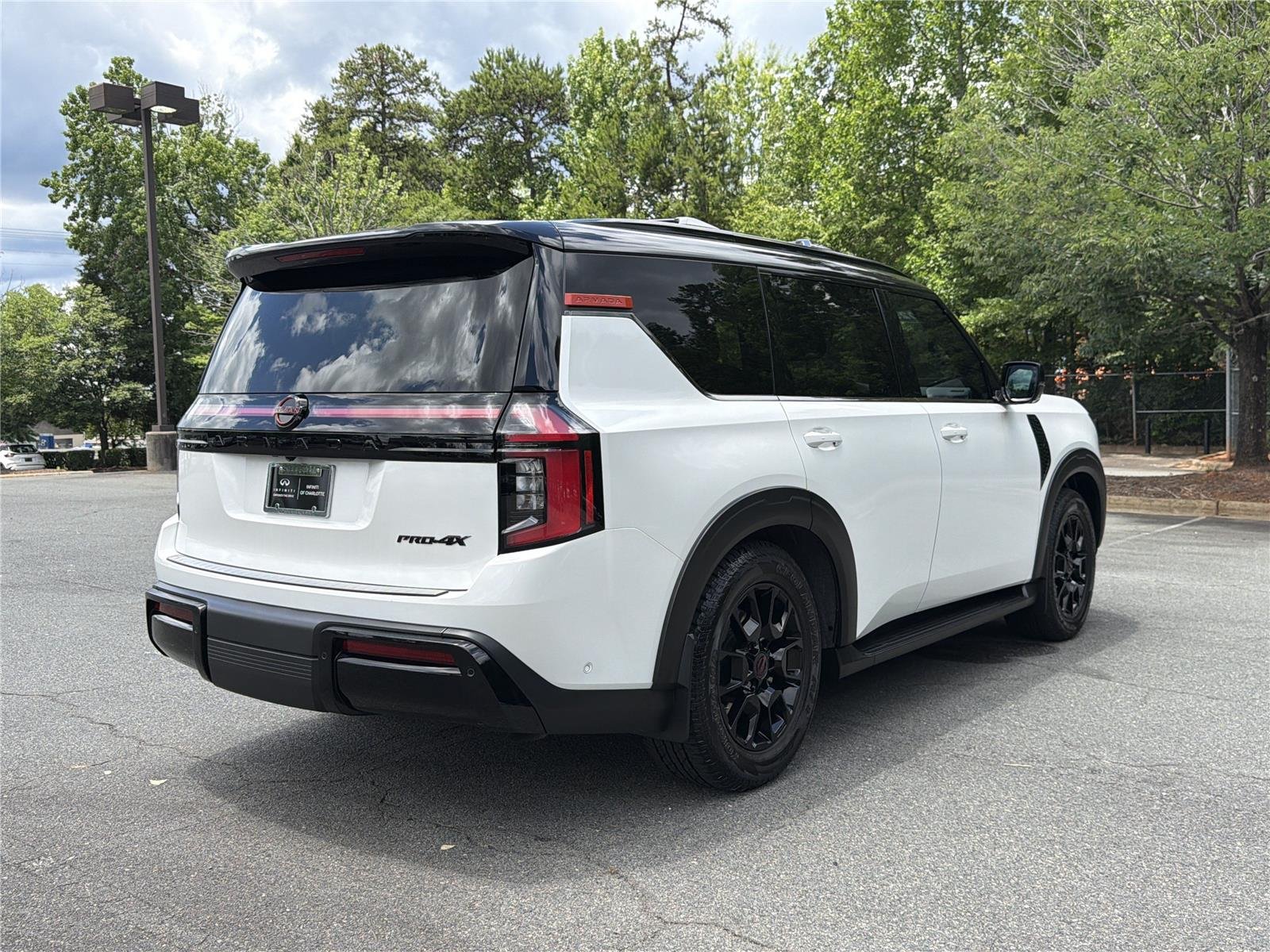 Used 2025 Aspen White Tricoat/Super Black Nissan PRO-4X image 27