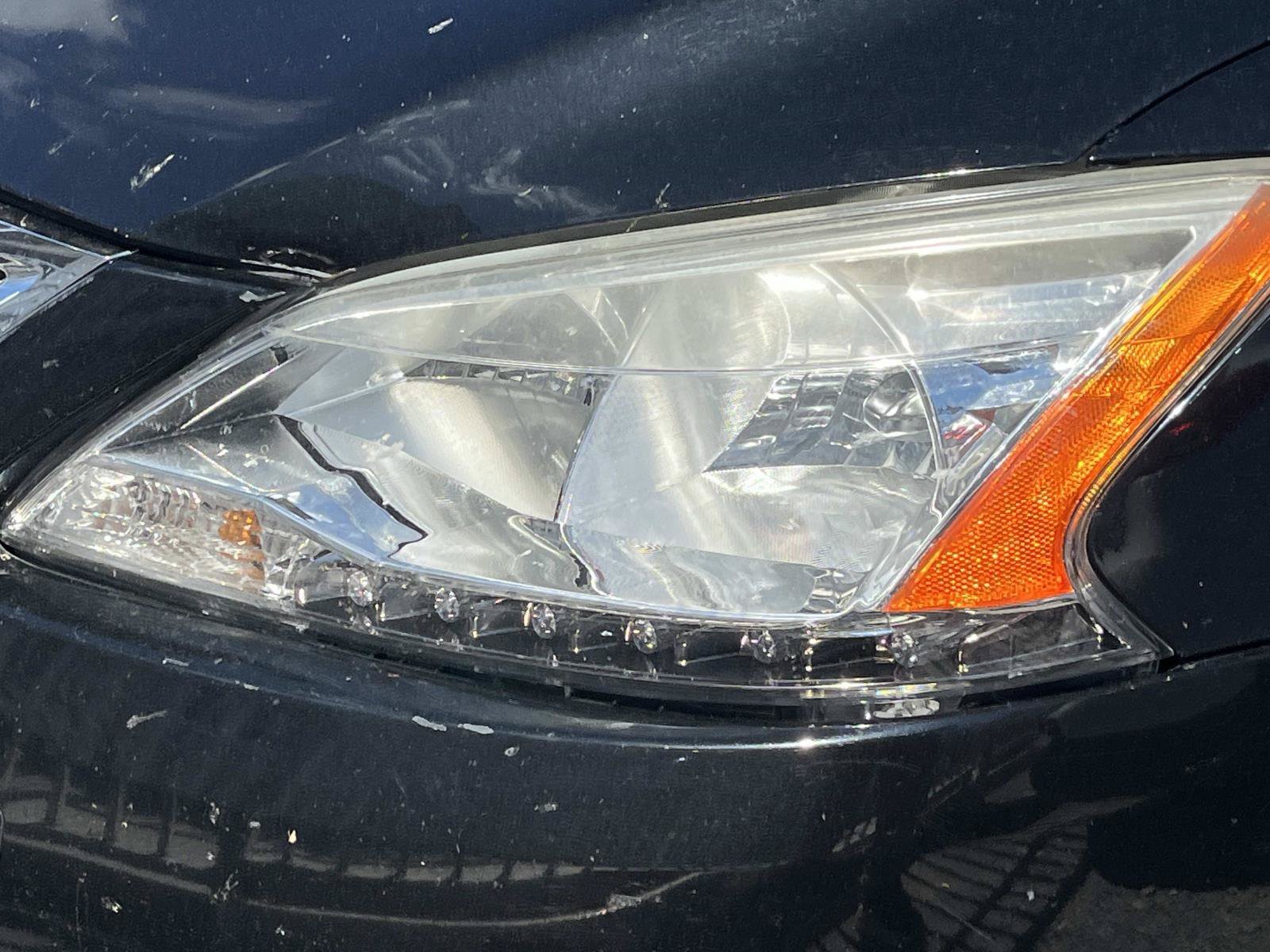 Used 2014 Super Black Nissan SV image 2