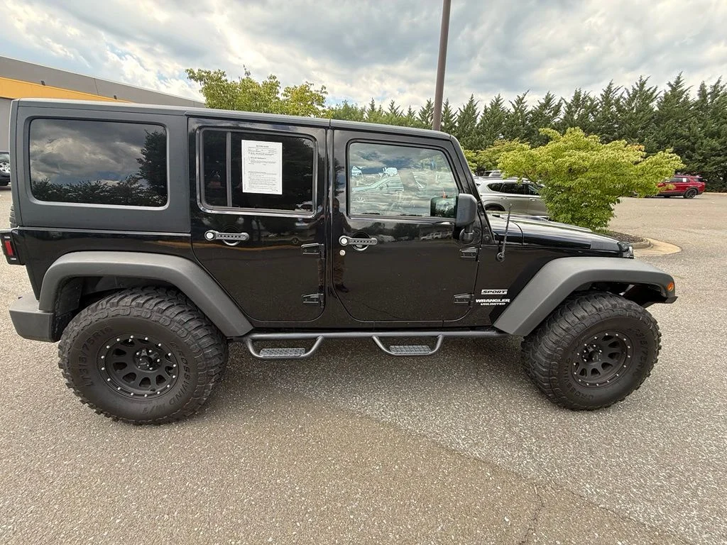 Used 2011 Black Jeep Unlimited Sport image 8