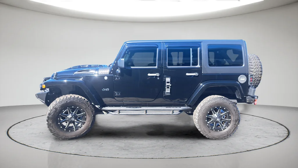 Used 2015 Black Jeep Unlimited Sahara image 7