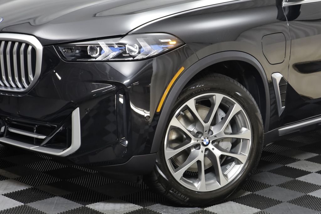 New 2026 Black Sapphire Metallic BMW xDrive50e image 4
