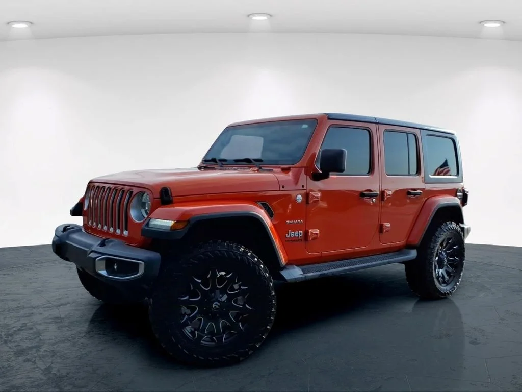 Used 2018 Orange Jeep Unlimited Sahara image 2