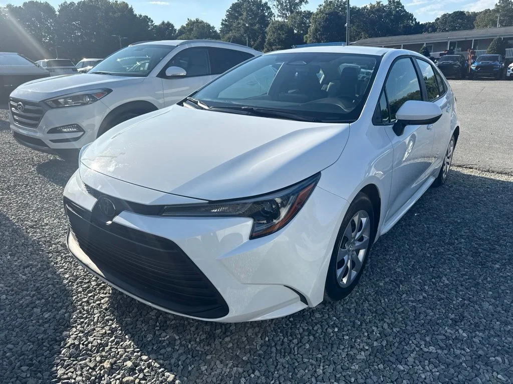 Used 2025 White Toyota LE image 1