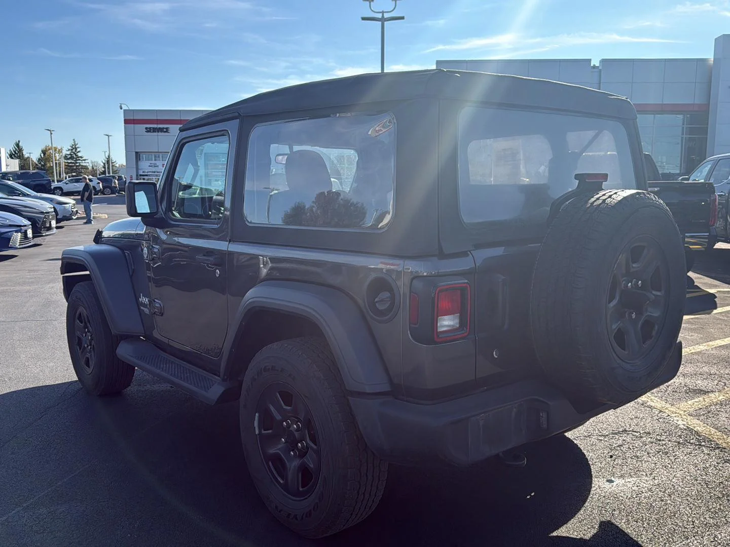 Used 2018 Granite Crystal Metallic Clearcoat Jeep Sport image 5