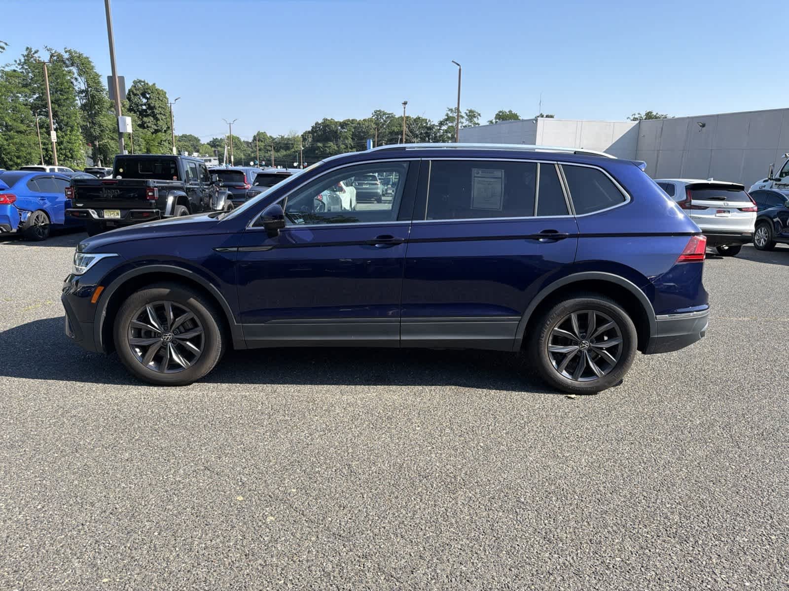 Used 2022 Atlantic Blue Metallic Volkswagen SE image 2