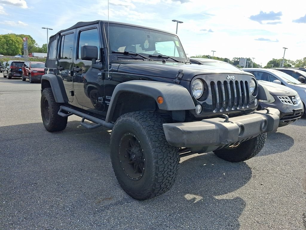 Used 2015 Black Jeep Unlimited Sport image 1