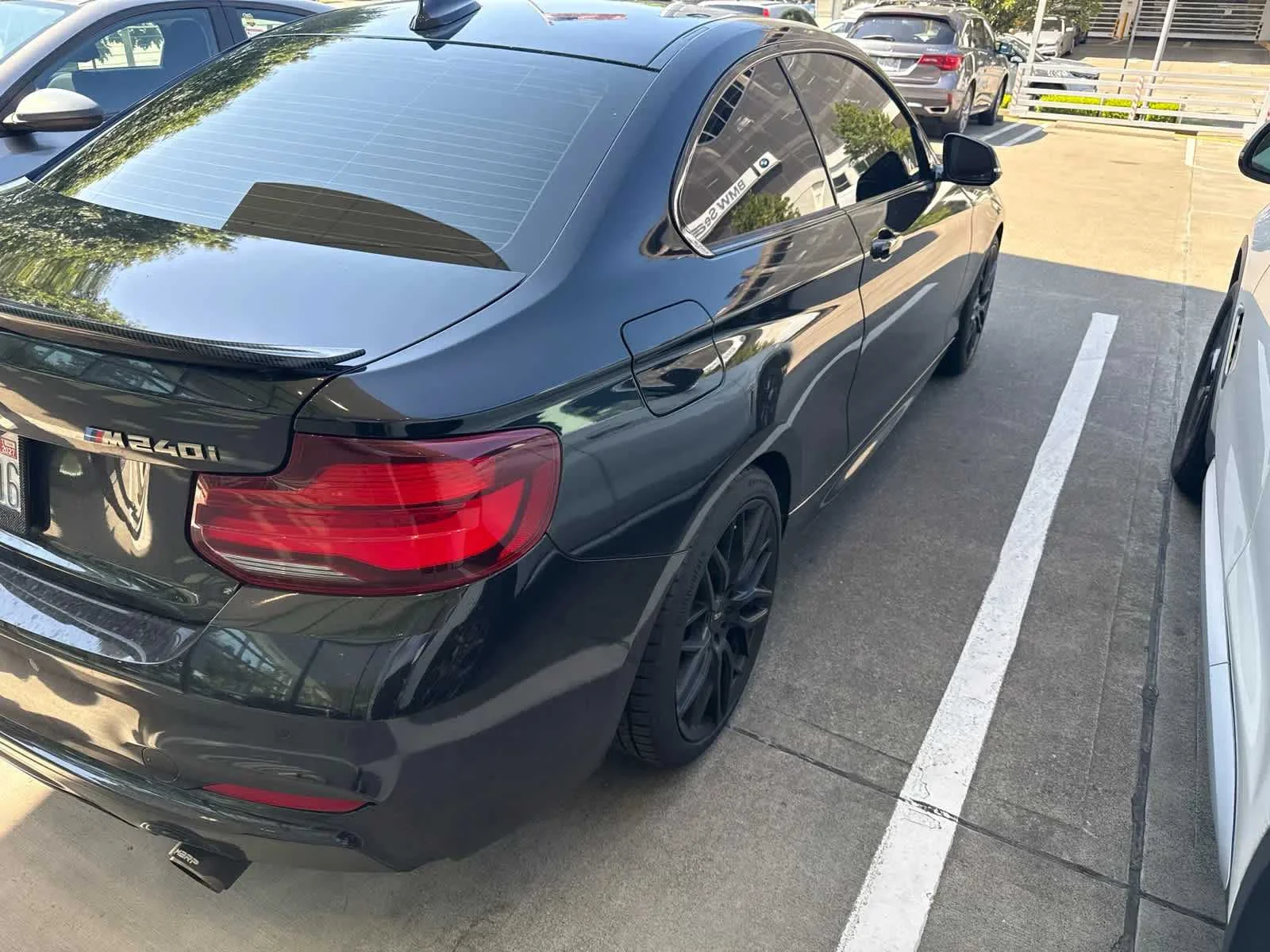 Used 2020 Black Sapphire Metallic BMW M240i xDrive image 1