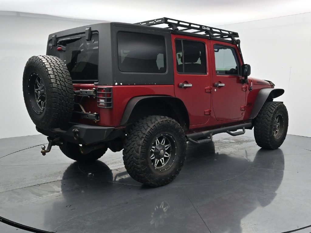 Used 2012 Red Jeep Unlimited Sport image 8