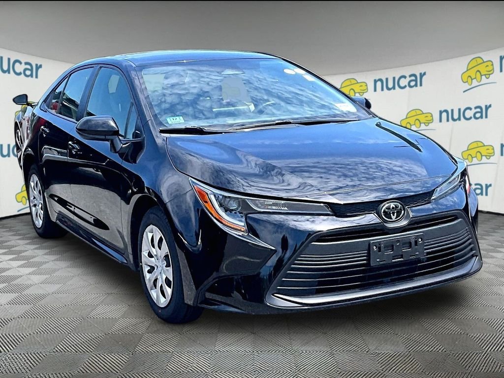 Used 2024 Black Toyota LE image 1