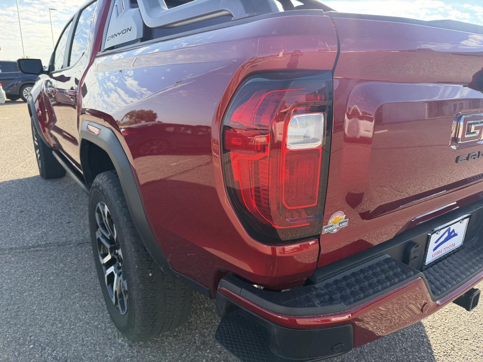 Used 2025 Volcanic Red Tintcoat GMC 4WD AT4 image 12