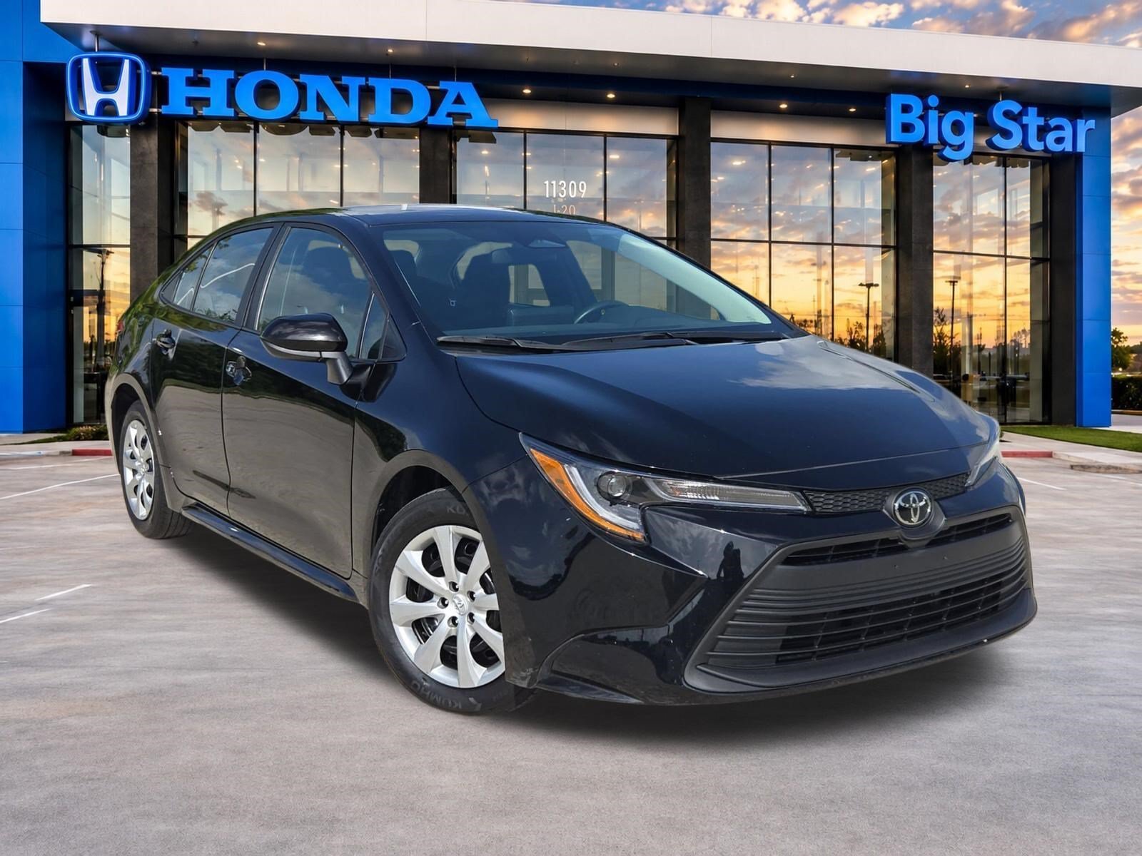 Used 2025 Midnight Black Metallic Toyota LE image 1