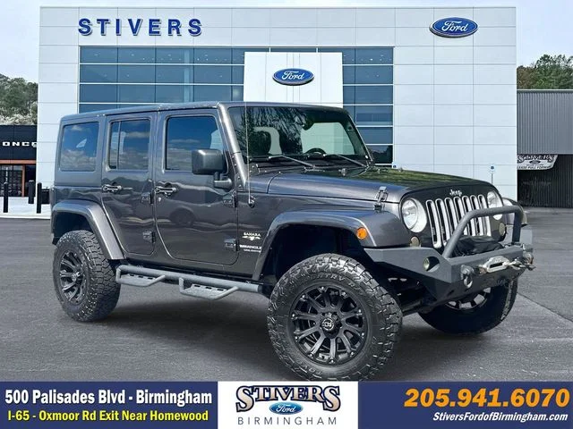 Used 2016 Gray Jeep Unlimited Sahara image 1