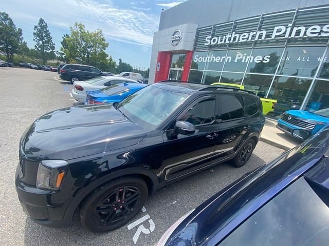 Used 2025 Black Kia EX X-Line image 6