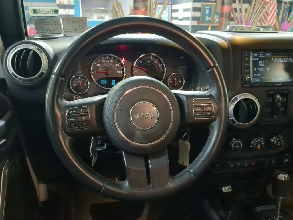 Used 2016 White Jeep Unlimited Sahara image 2