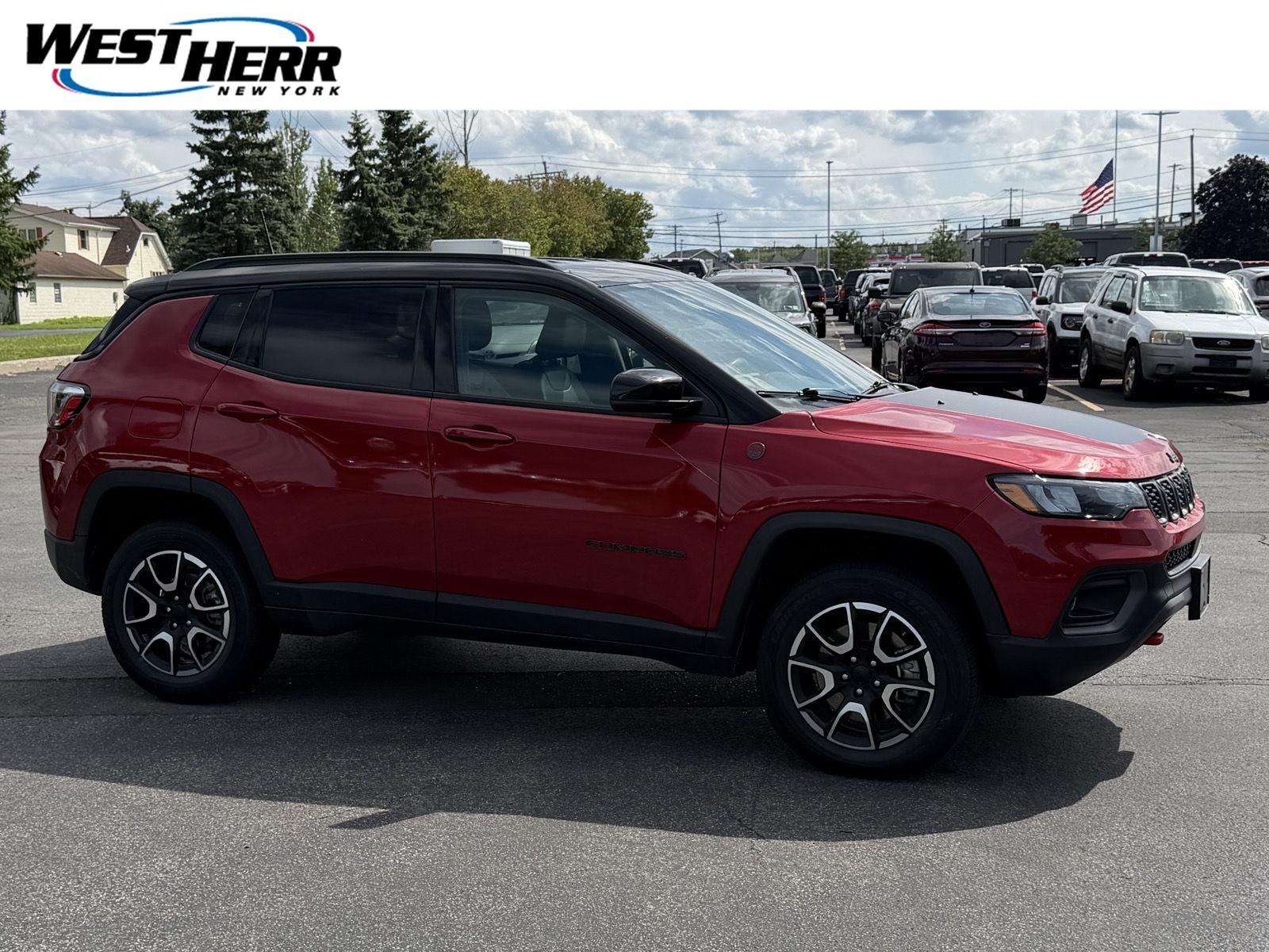 Used 2024 Red Hot Pearlcoat Jeep Trailhawk image 1