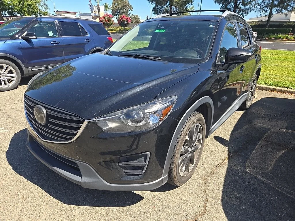 Used 2016 Jet Black Mazda Grand Touring image 1
